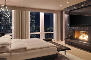 related-corporate-hospitality-landscape-equinoxsuite-bedroom-fireplace.jpg
